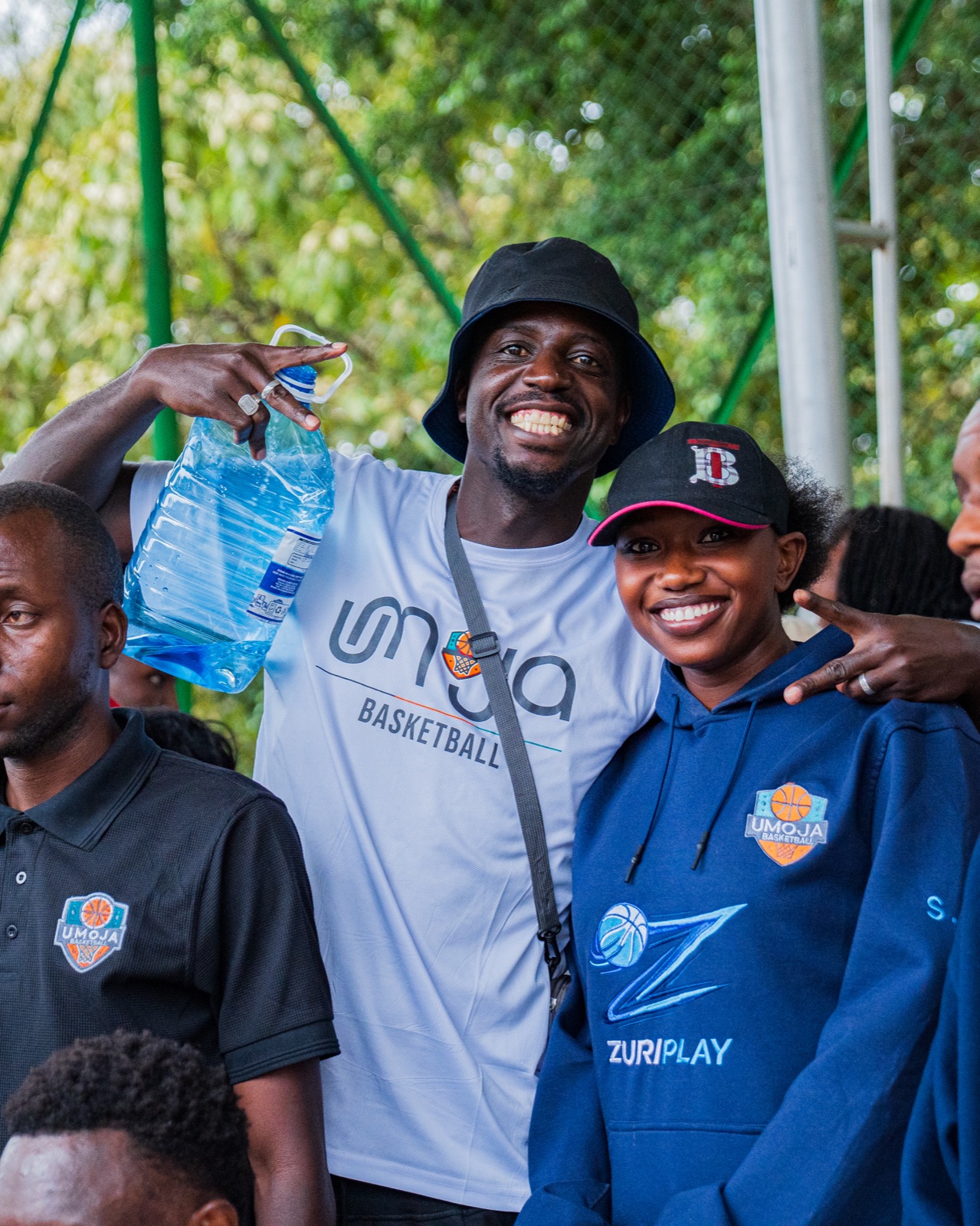 Umoja supporters smiling together in club gear
