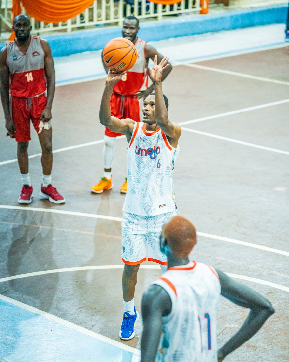 Umoja player shooting a free throw during last year's playoff meeting with Equity