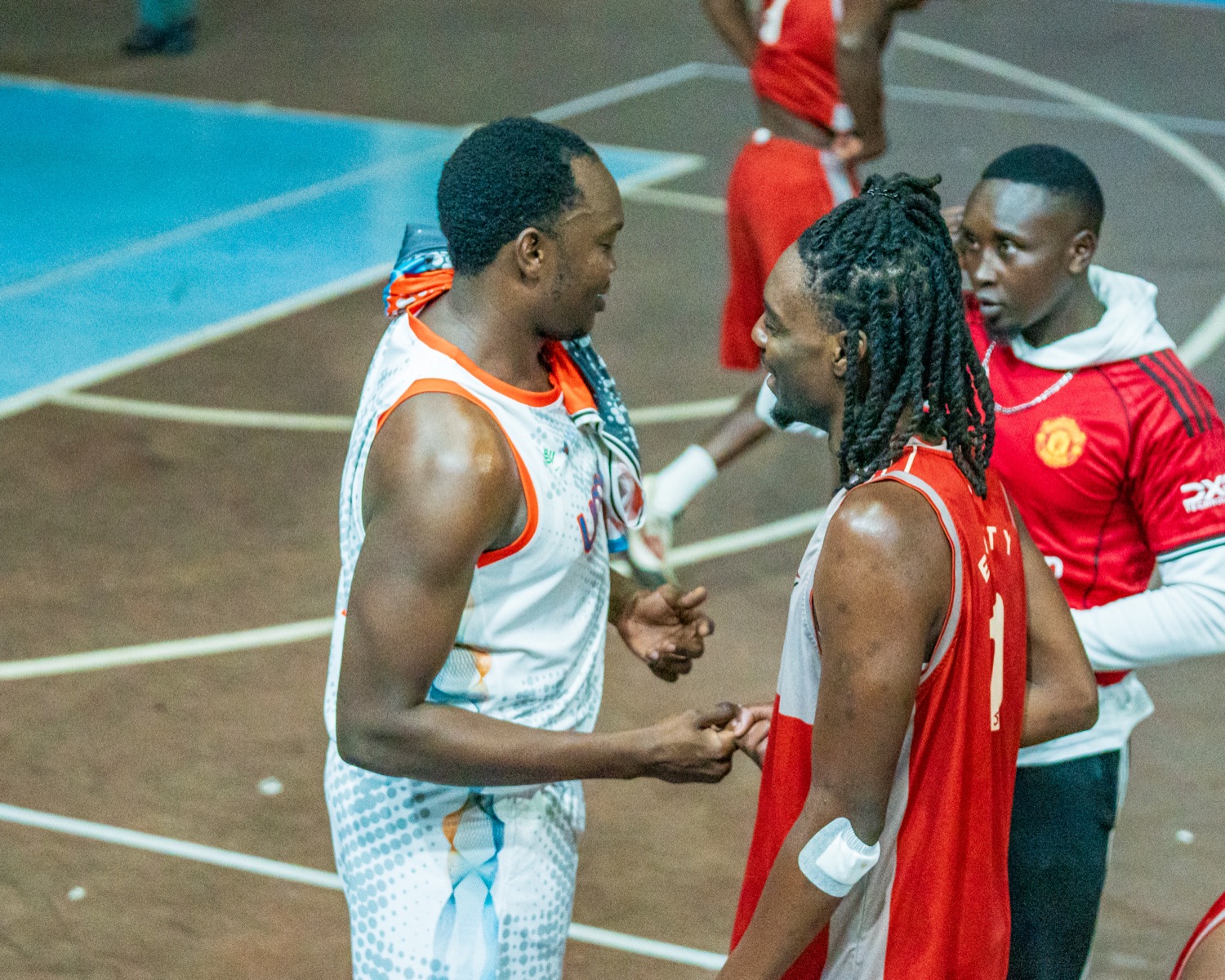 Umoja and Equity players greeting each other during last year's playoff series