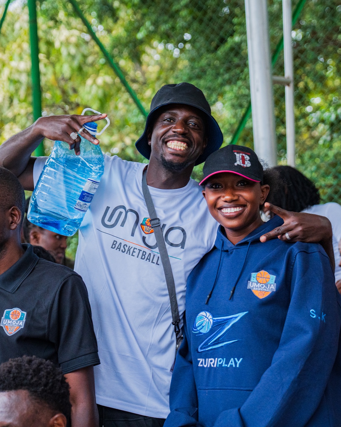 Umoja supporters smiling at courtside