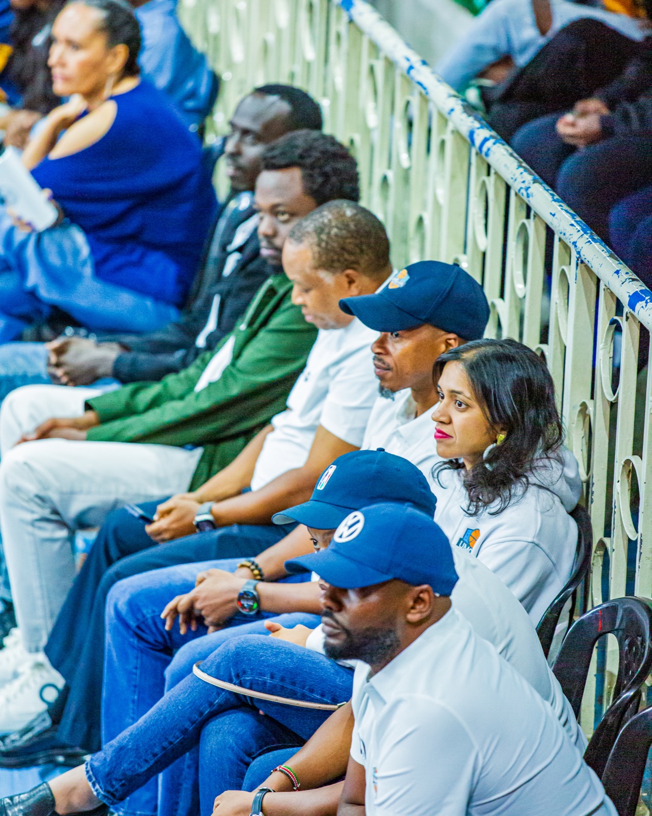 Umoja supporters sitting together and following the game closely