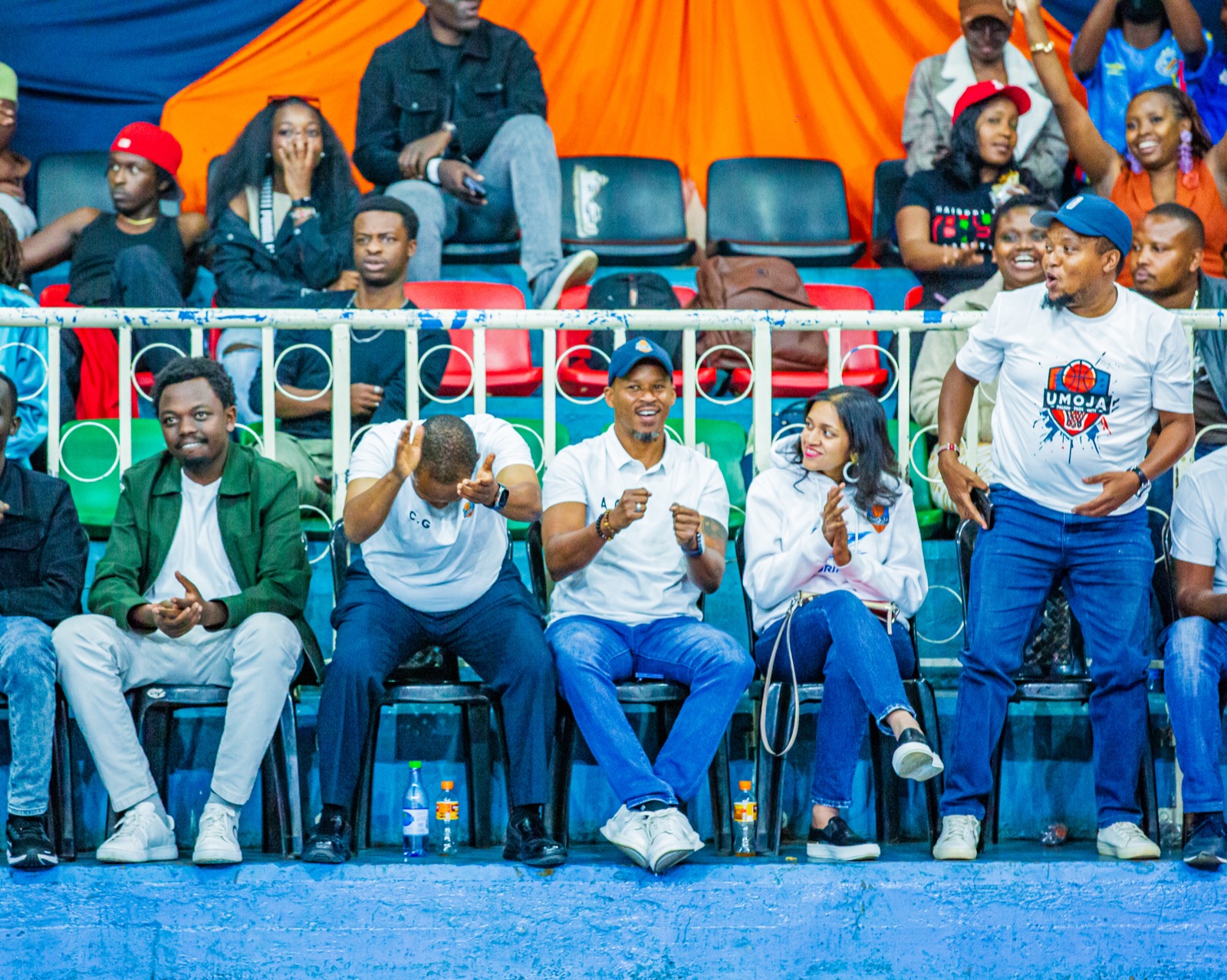 Umoja supporters and staff reacting from the stands