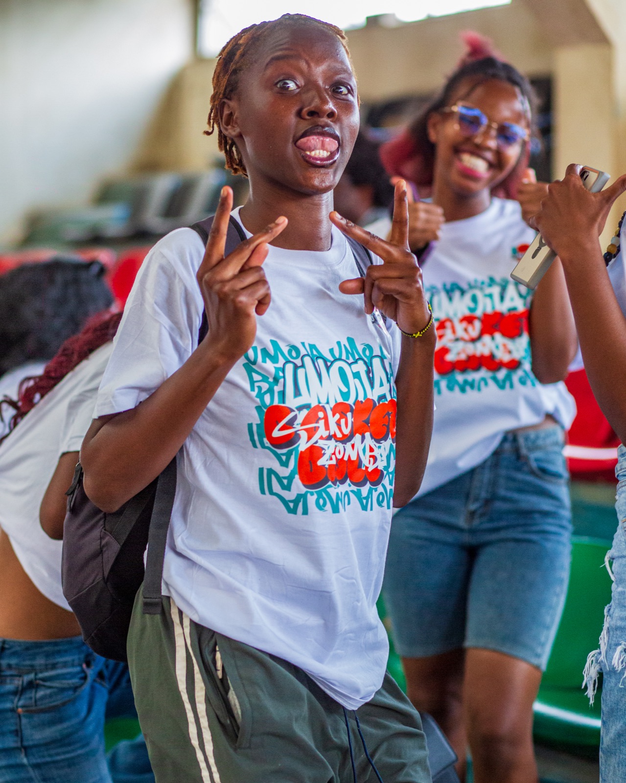 Umoja supporters posing in club shirts