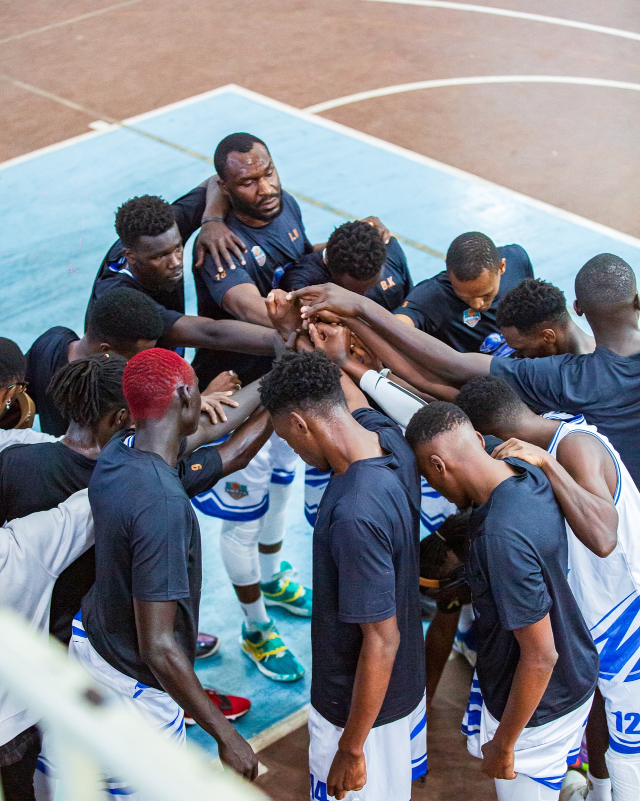 Umoja team huddle before playoff action